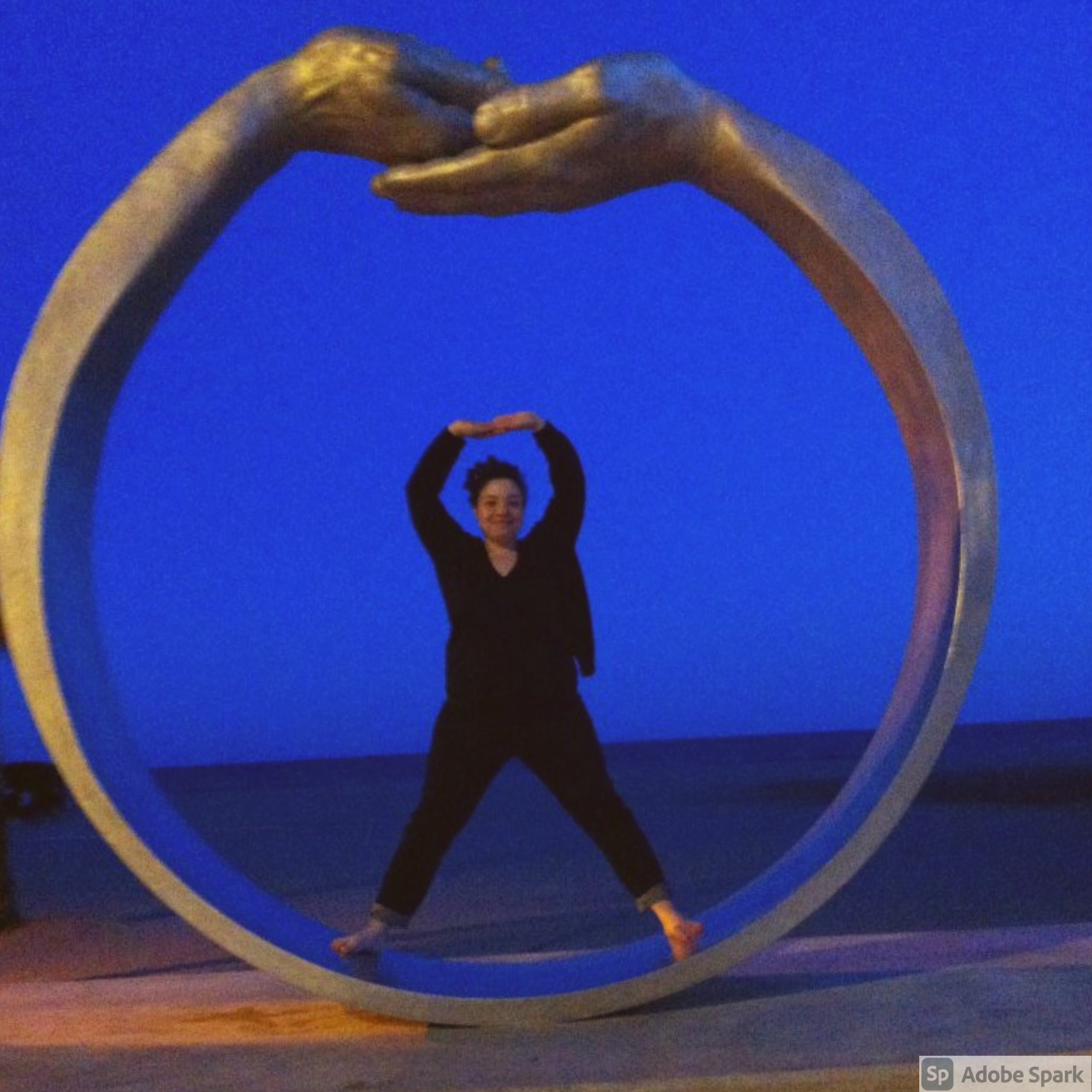 Treasure posing inside a large circular sculpture